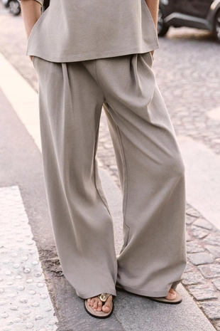 Брюки из ткани с эффектом потертости