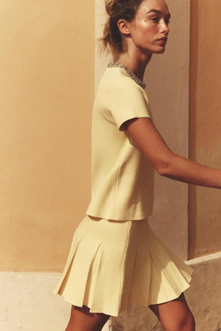 Трикотажная мини-юбка в складку- Заказать в России