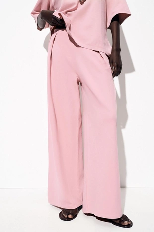 Брюки из ткани с эффектом потертости- Заказать в России