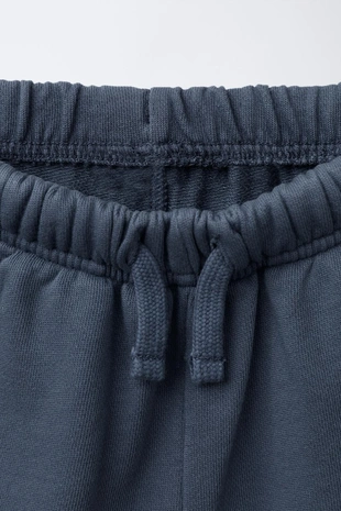 STRAIGHT FIT GARMENT-DYED PLUSH BERMUDA SHORTS WITH LABEL