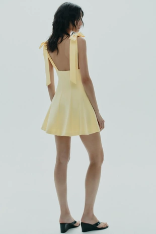 Короткое комбинированное платье с бантами- Заказать в России