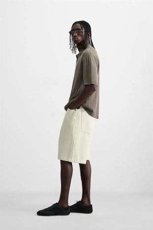 Поло из трикотажа с эффектом стирки- Заказать в России