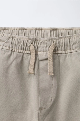 Брюки-джоггеры с резинками- Заказать в России