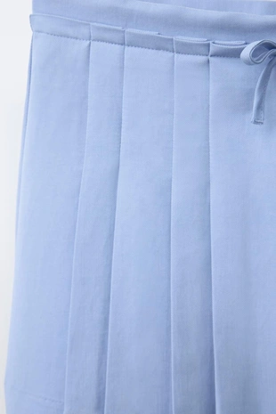 Юбка струящегося кроя в складку