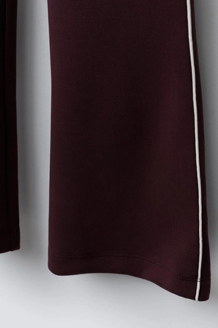 Расклешенные брюки из модала с контрастной отделкой- Заказать в России