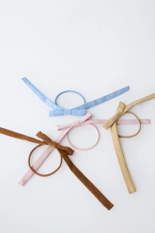 Набор из четырех резинок для волос с бантами под замшу- Заказать в России