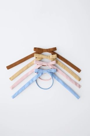 Набор из четырех резинок для волос с бантами под замшу- Заказать в России