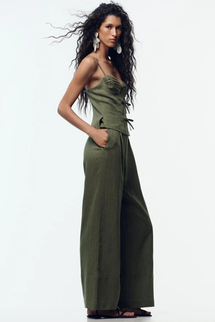 Льняной комбинезон на бретелях с бантами- Заказать в России