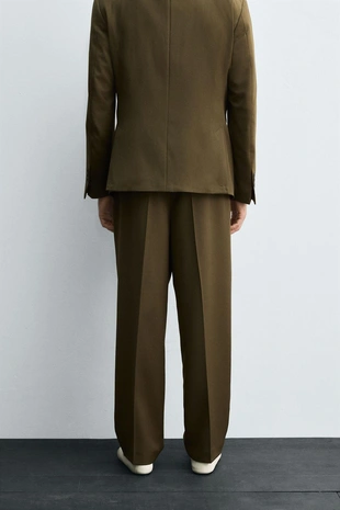 Костюмные брюки со складками — LIMITED EDITION- Заказать в России