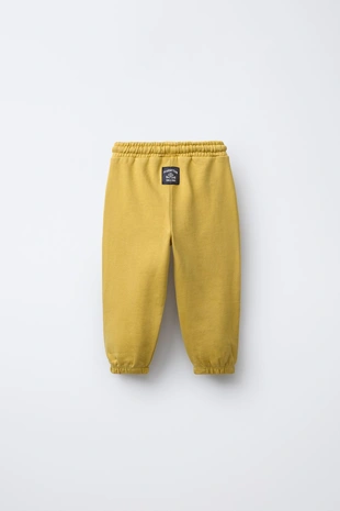 Брюки-джоггеры с нашивкой - Заказать в России