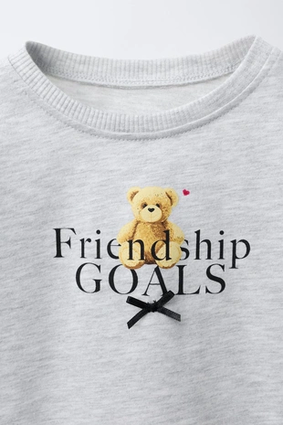 Футболка с анималистическим принтом и бантиком