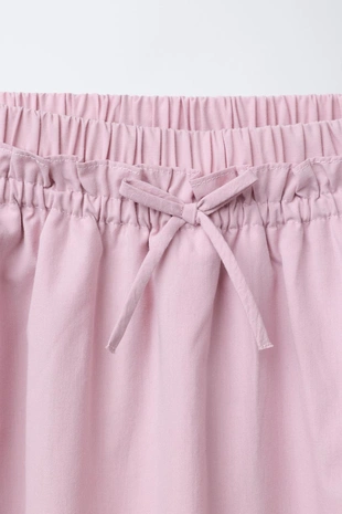 Юбка-шорты с воланами и жемчугом