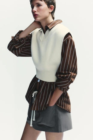 Короткий однотонный трикотажный жилет- Заказать в России