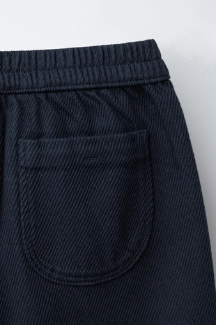 Брюки из мягкой ткани с пуговицами- Заказать в России