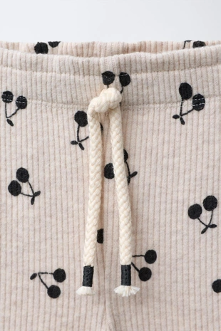 Мягкие расклешенные брюки с принтом- Заказать в России