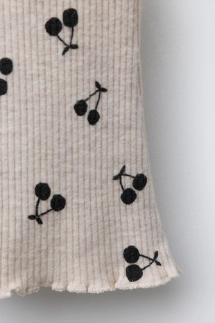 Мягкие расклешенные брюки с принтом- Заказать в России