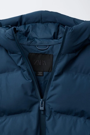 Стеганый пальто с нашивкой WATER REPELLENT- Заказать в России