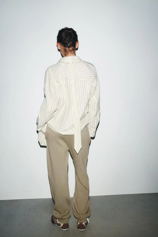 Джоггеры из мягкой ткани с эффектом потертости- Заказать в России