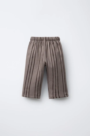 Брюки в полоску с нашивкой- Заказать в России