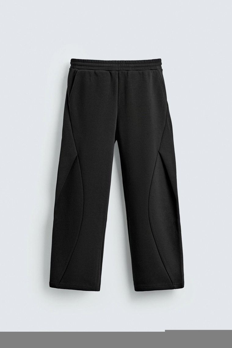 Брюки свободного кроя с плиссированными шарами эффекта неопрена