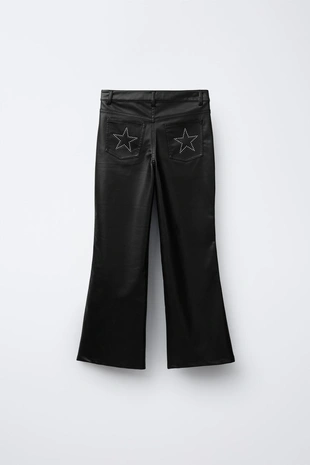 Расклешенные брюки из искусственной кожи с заклепками- Заказать в России