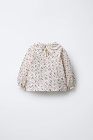 Футболка с отложным воротником и цветочным принтом- Заказать в России