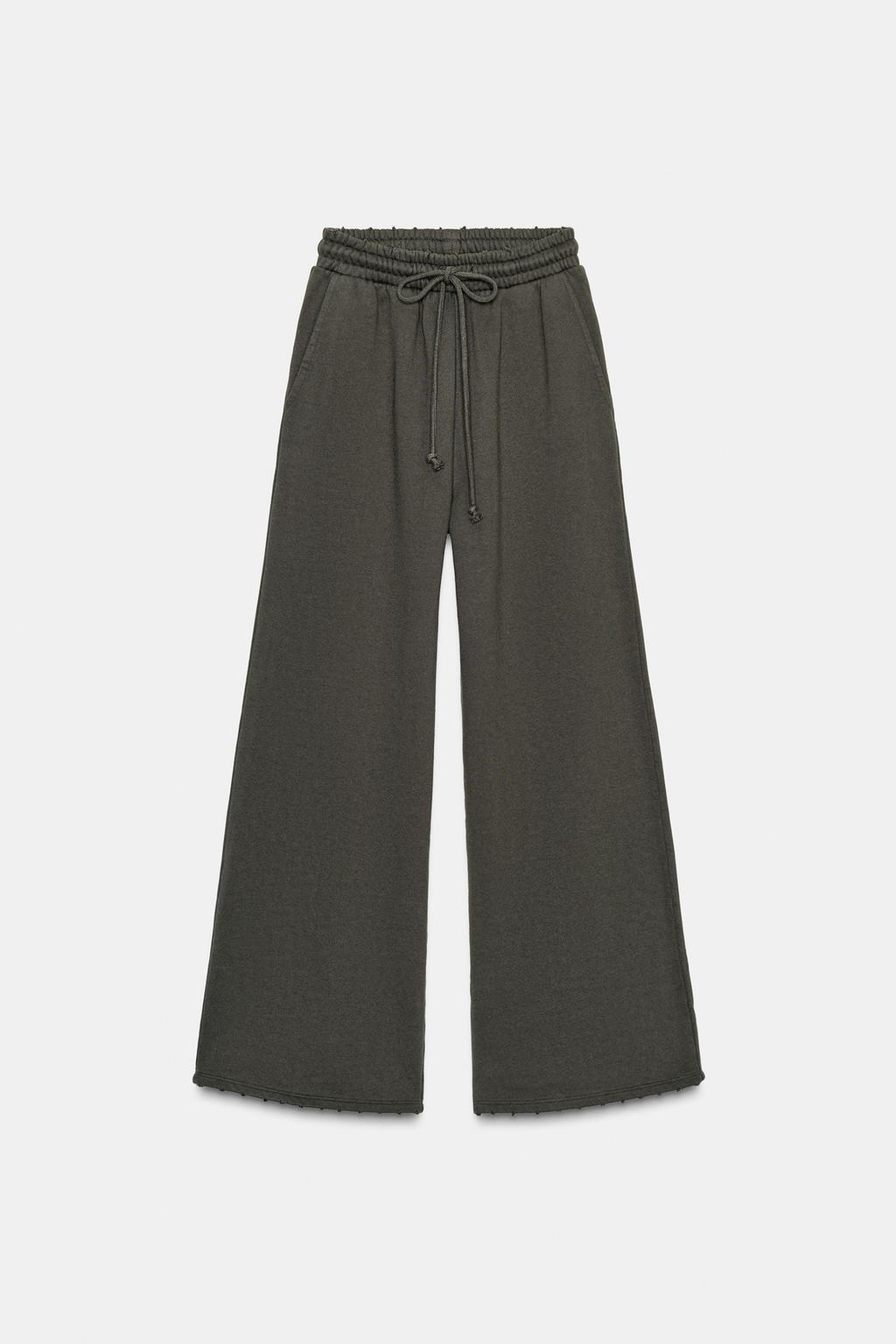 БРЮКИ С ЭФФЕКТОМ ПОТЕРТОСТИ, ЗВЕЗДАМИ И ЗАКЛЕПКАМИ