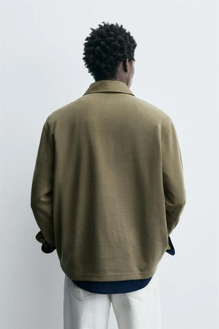 Поло из рельефного пике с эффектом потертости- Заказать в России