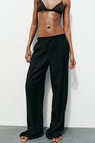 Брюки из ткани с рельефным узором - Заказать в России