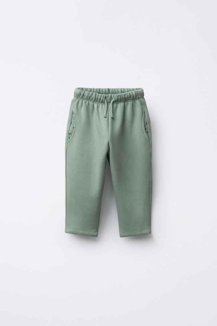 Брюки из плюша с карманами в цветочный принт