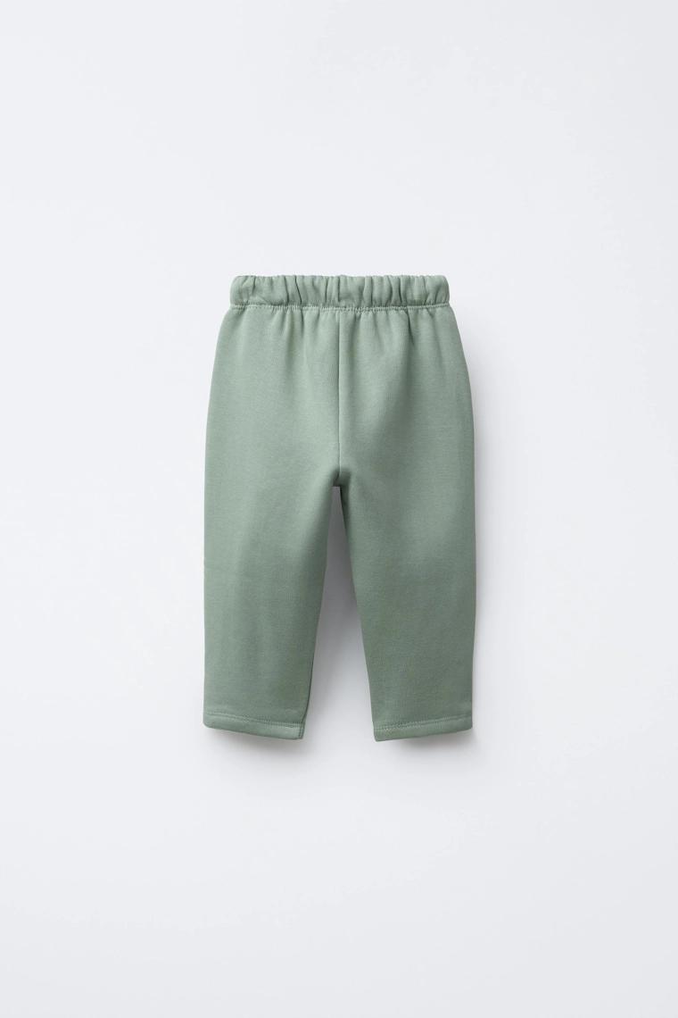 Брюки из плюша с карманами в цветочный принт