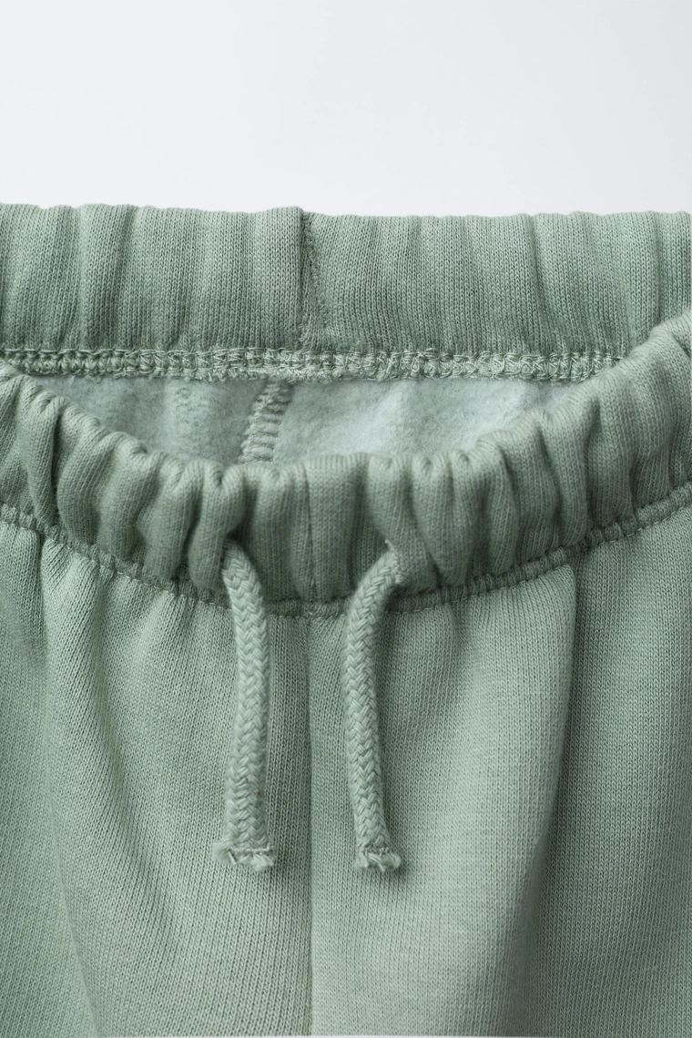 Брюки из плюша с карманами в цветочный принт