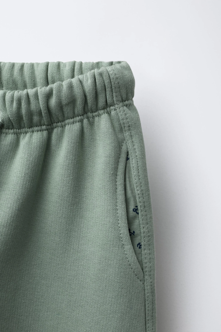 Брюки из плюша с карманами в цветочный принт