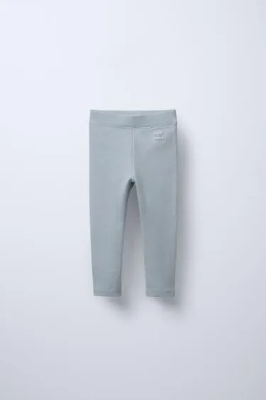 Легинсы в рубчик с нашивкой- Заказать в России