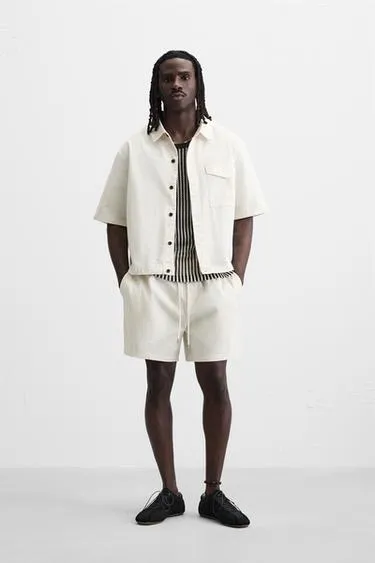 Шорты RELAXED FIT из ткани с эффектом потертости