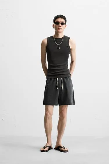 Шорты RELAXED FIT из ткани с эффектом потертости
