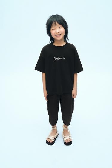 Zara Однотонная футболка с надписью X FANGLU LIN купить с доставкой.