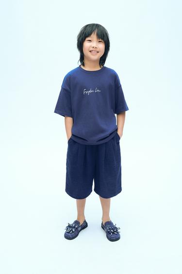 Zara Однотонная футболка с надписью X FANGLU LIN купить с доставкой.