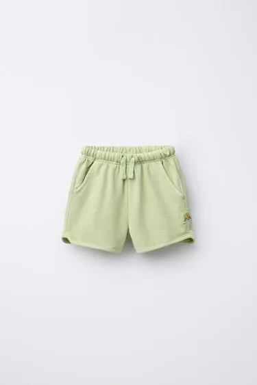 STRAIGHT FIT GARMENT-DYED PLUSH BERMUDA SHORTS WITH LABEL