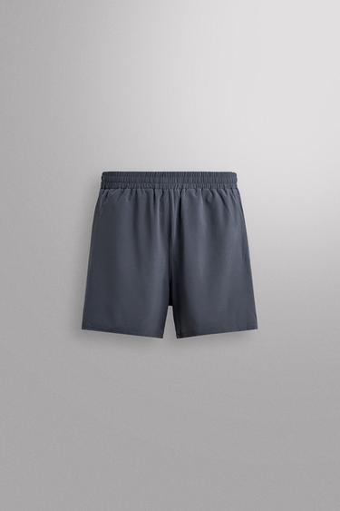Zara Комбинированные шорты с перфорацией купить с доставкой.