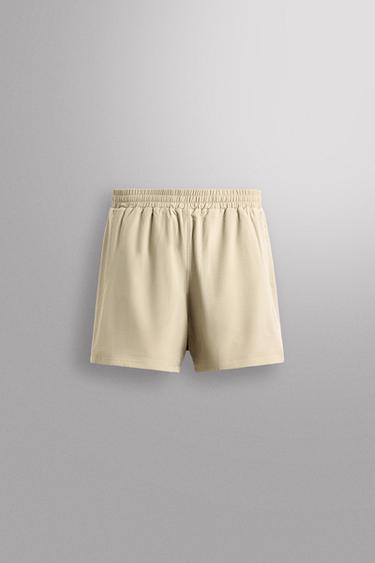 Zara Комбинированные шорты с перфорацией купить с доставкой.