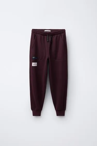 Брюки-джоггеры с нашивками- Заказать в России