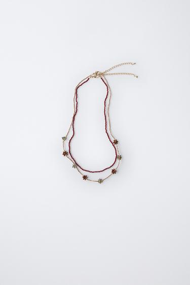 Zara Набор из двух ожерелий с бусинами и цветами купить с доставкой.