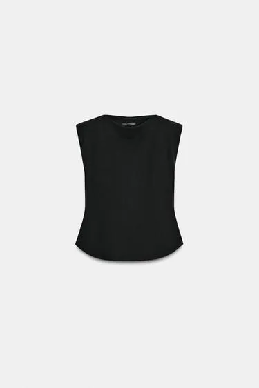 Топ из крепа с баской и подплечниками