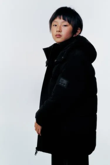 Длинное стеганое пальто с этикеткой