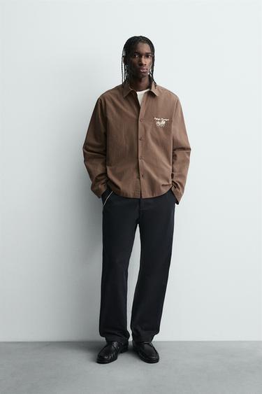 Zara Рубашка в полоску с графическим принтом