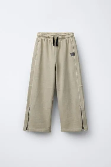 Широкие плюшевые брюки в меланжевой окраске- Заказать в России