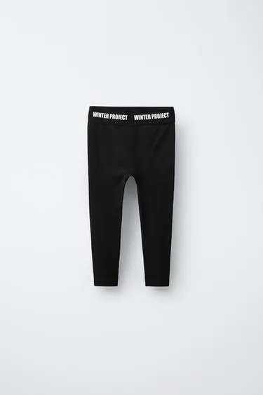 Рифленые леггинсы с пробивным лозунгом- Заказать в России