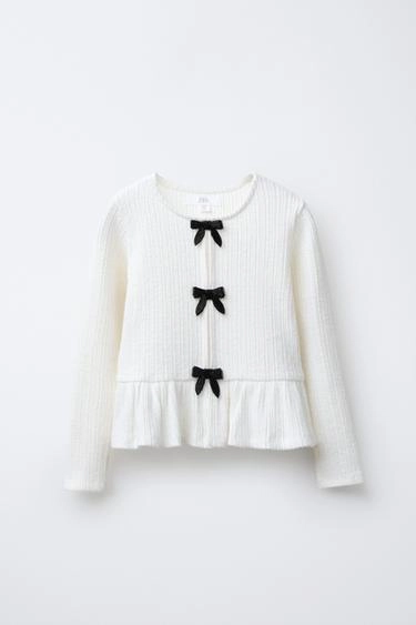 Футболка из мягкого ребристого материала с бантами- Заказать в России