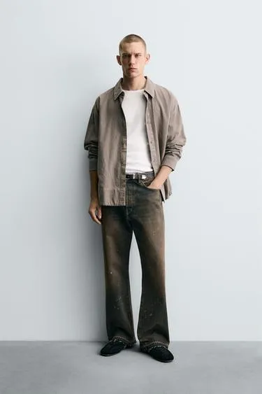 Джинсы свободного кроя с брызгами